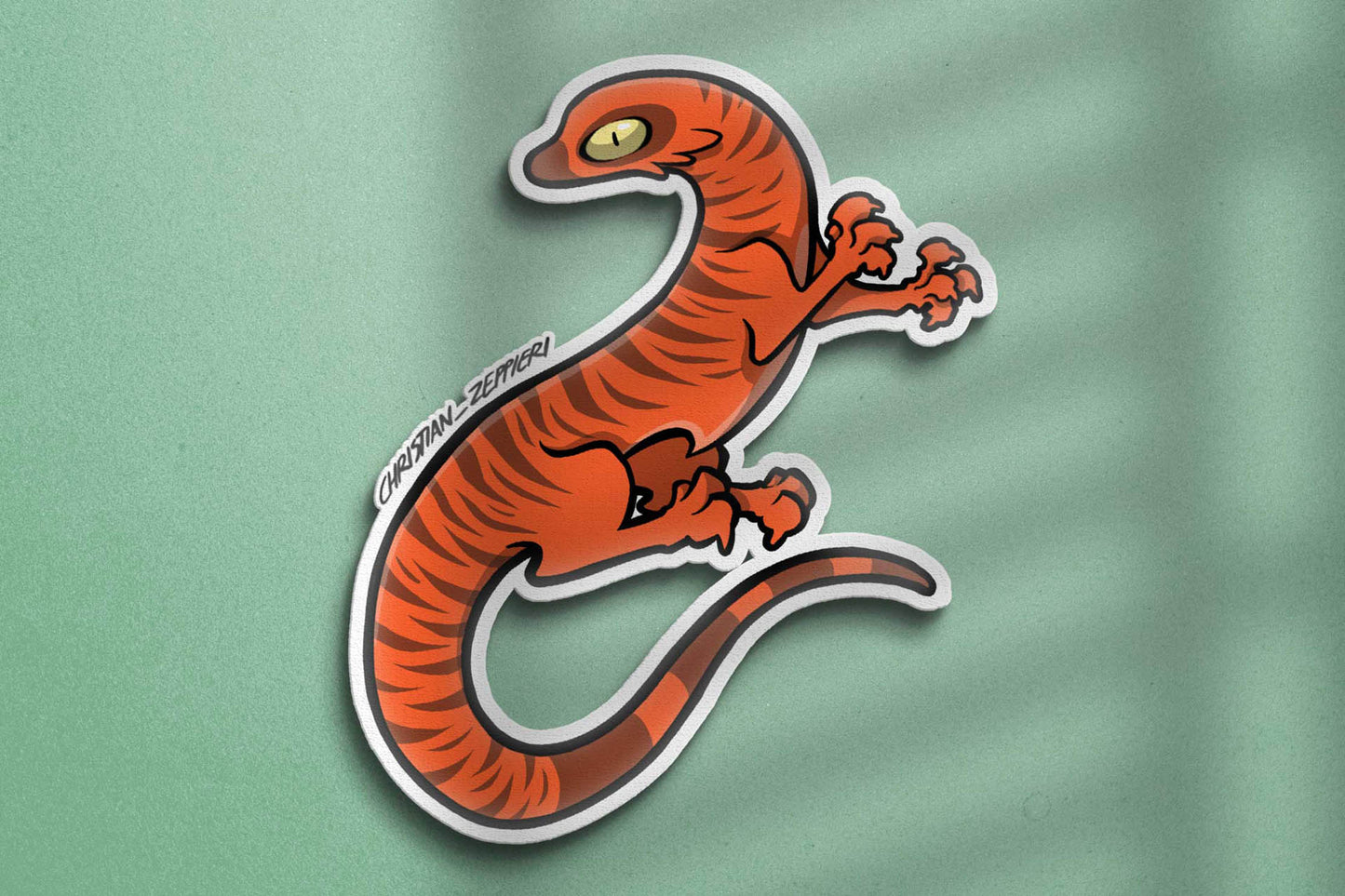 Close-up view of Christian Zeppieri's sticker Red Lizard